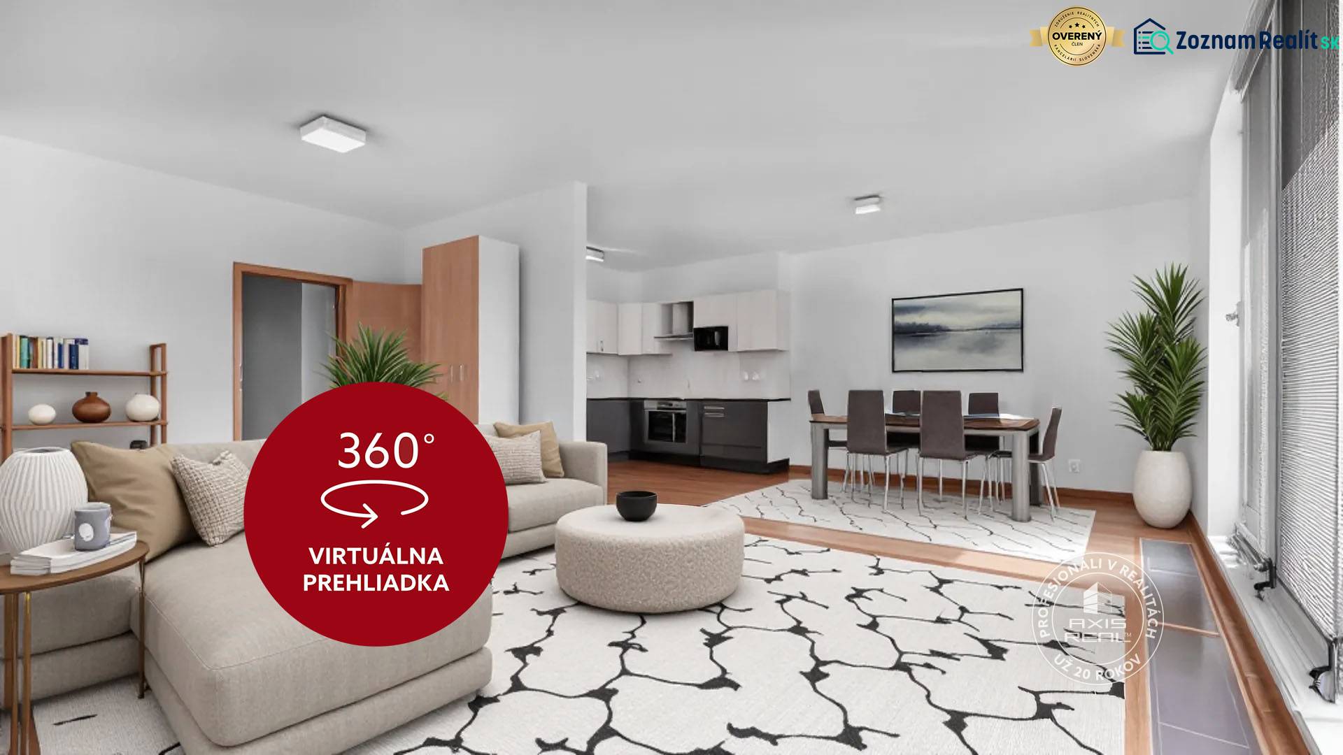 Nappali egy háromszobás lakásban kanapéval, étkezőasztallal és konyhabútorral.