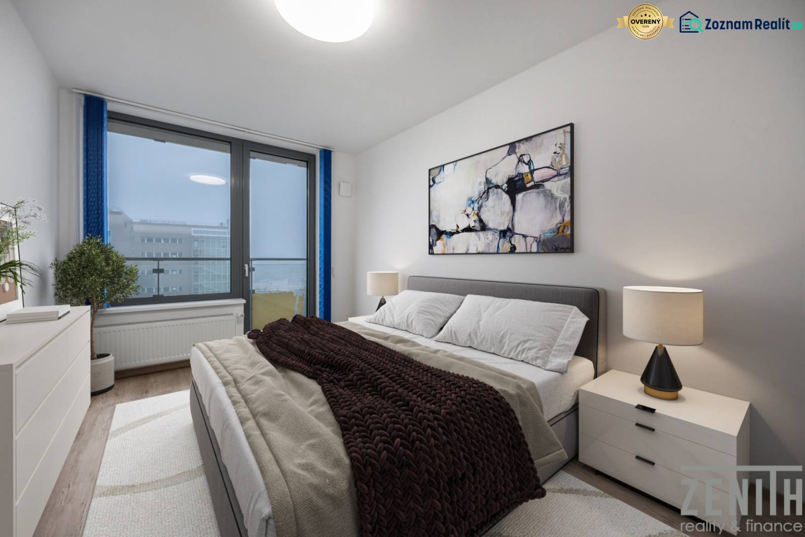 Hálószoba egy kétszobás lakásban kényelmes ággyal, képpel és lámpával az éjjeliszekrényen.