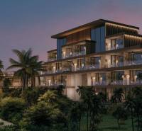 Többszintes családi ház kilátása pálmafákkal a Nungwi utcán, Zanzibar North.