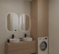 Fürdőszoba fa bútorokkal és két mosdókagylóval, mosógép a ruhák mosásához.