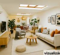 Világos üzlethelyiség kanapéval, növényekkel és faldekorációkkal.