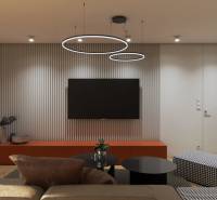 Nappali egy családi házban, fa dekorációjú padlóval és minimalista berendezéssel.