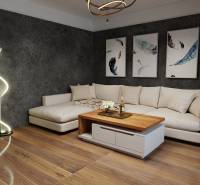 Tágas nappali egy háromszobás lakásban fehér kanapéval és fa hatású padlóval.