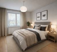 Hálószoba egy háromszobás lakásban franciaággyal és fa dekorációjú padlóval.