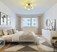 Hálószoba egy háromszobás lakásban ággyal, székkel és fa dekorációjú padlóval.