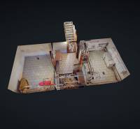 Családi ház belső tere csempézett padlóval, konyhával és lépcsővel.