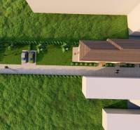 Légi felvétel a bevezető útról, autókról és zöldterületről a Litoměřická utcai 2 szobás lakásnál Topoľčiankyban.