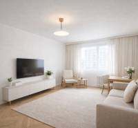 Nappali egy egyszobás lakásban, fa mintázatú padlóval, világos bútorokkal és televízióval.