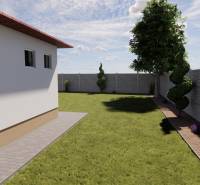 Családi ház kertje Zemianska Olčában gyepes és díszcserjékkel, kerítéssel körülvéve.