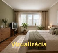 Hálószoba fa dekor padlóval, televízióval és tágas ággyal egy 4 szobás lakásban.