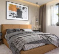 Modern hálószoba családi házban kényelmes boxspring ággyal és dekoratív elemekkel.
