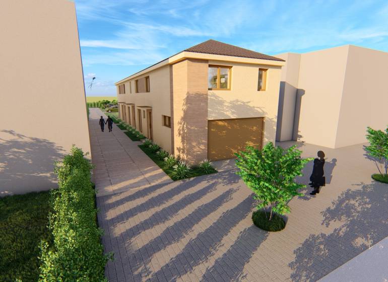 Kétszintes épület a Litoměřicei úton Topoľčiankyban, környező fákkal.