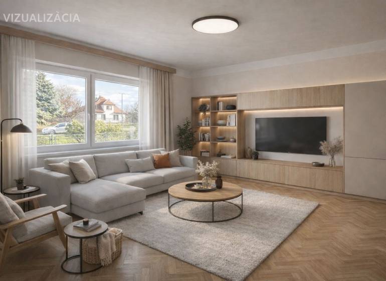 Nappali egy családi házban kényelmes ülőgarnitúrával és fa mintázatú padlóval.