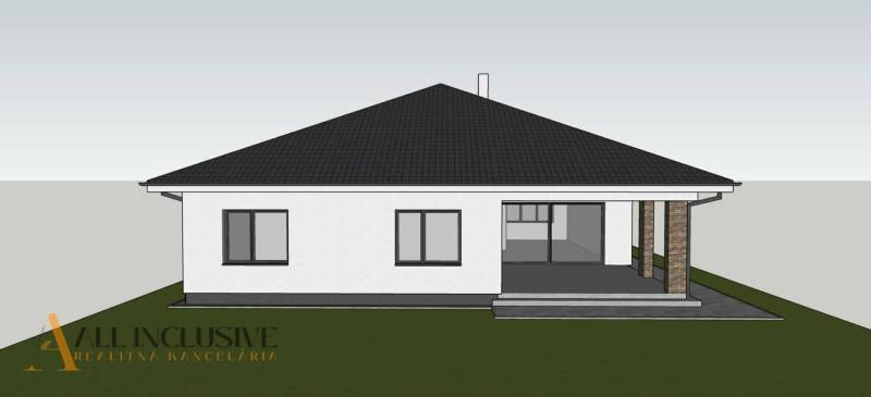 Családi ház Bajcsán fehér homlokzattal és tagolt tetővel.