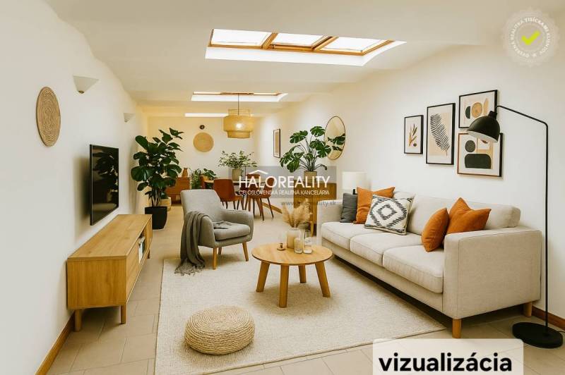 Világos üzlethelyiség kanapéval, növényekkel és faldekorációkkal.