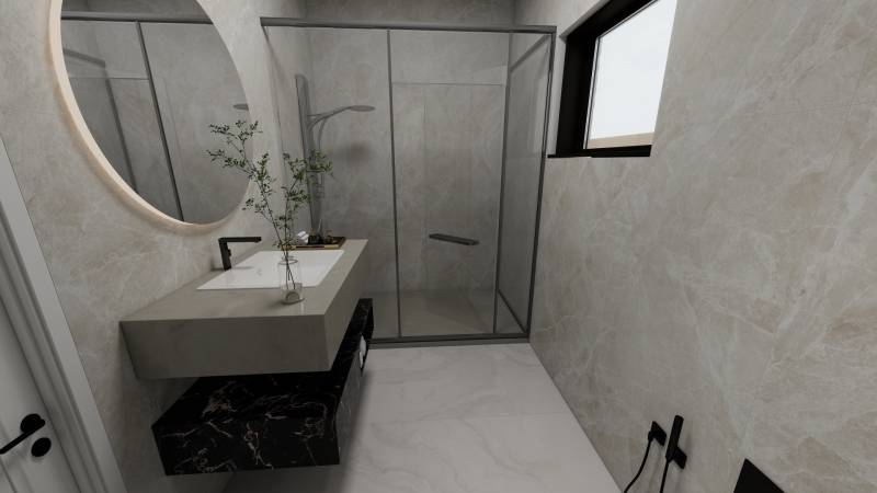 Fürdőszoba mosdóval, zuhanyzóval és ablakkal egy családi házban.