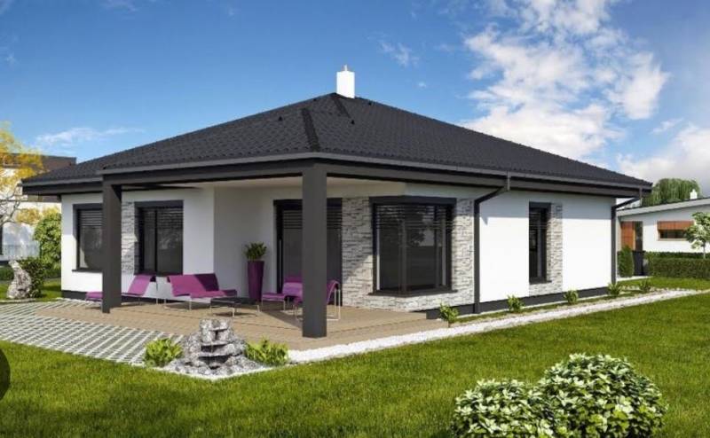 Családi ház Dunaszerdahely mellett terasszal, gyepfelülettel és kerti ülőhellyel.