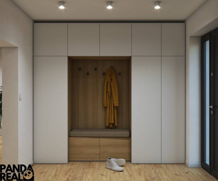 Családi ház előszobája gardróbfallal és fa mintázatú padlóval.