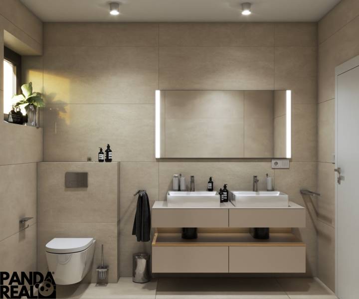 Fürdőszoba családi házban két mosdóval, megvilágított tükörrel és visszafogott dekorációkkal.