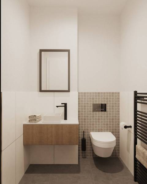 Fürdőszoba függesztett WC-vel, mosdóval, fűtéssel és tükörrel, dizájnos csempékkel.