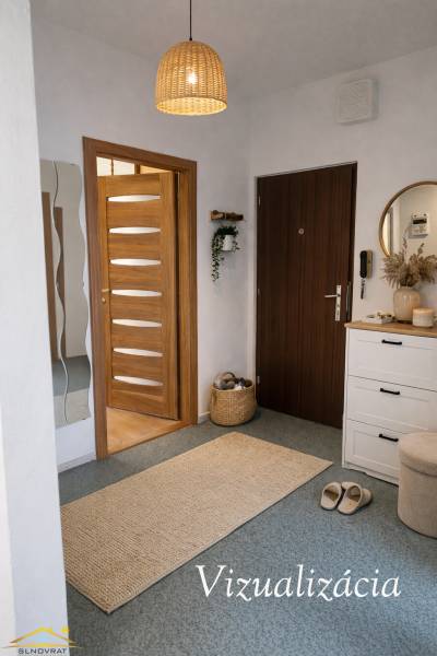 3 szobás lakás meleg világítással, faajtókkal és fehér bútorokkal.