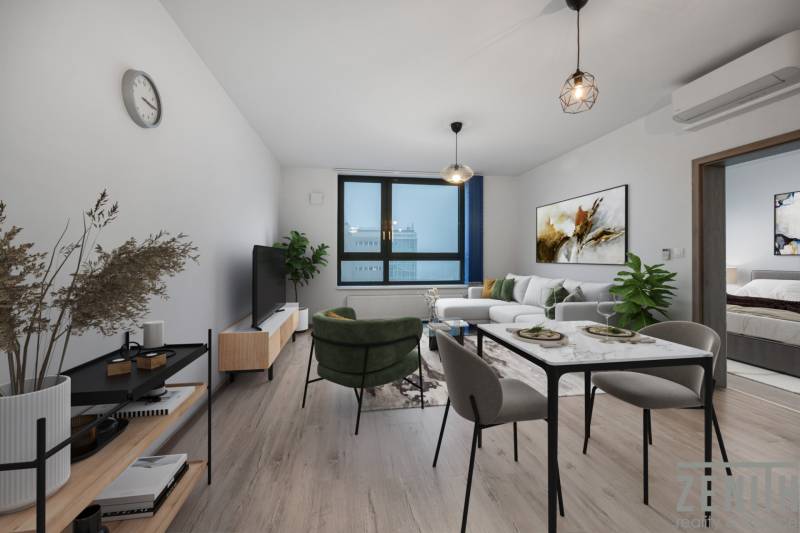 Nappali kanapéval és étkezőasztallal egy kétszobás lakásban, fa dekorációjú padlóval.