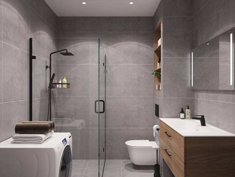 Fürdőszoba zuhanyzóval, mosdóval és mosógéppel egy egyszobás lakásban.