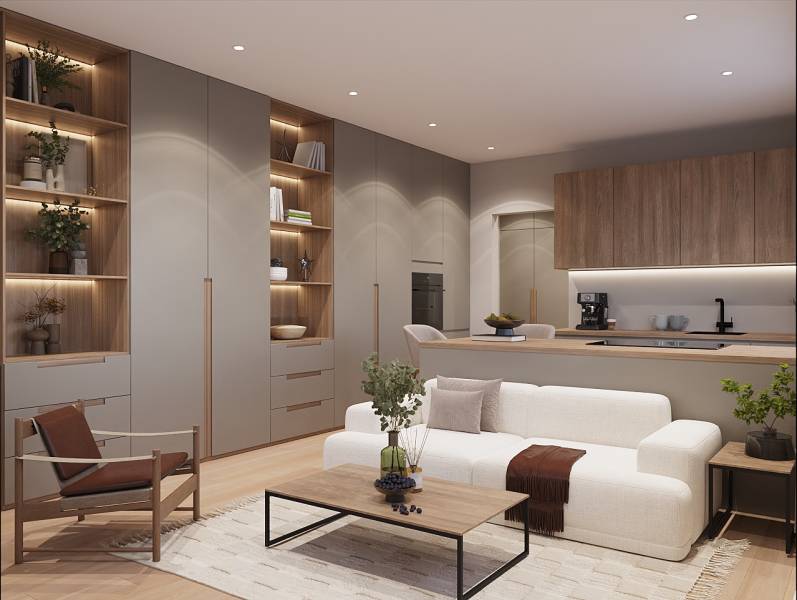 Világos nappali tér egy egyszobás lakásban, fa dekor padlóval és beépített könyvespolccal.