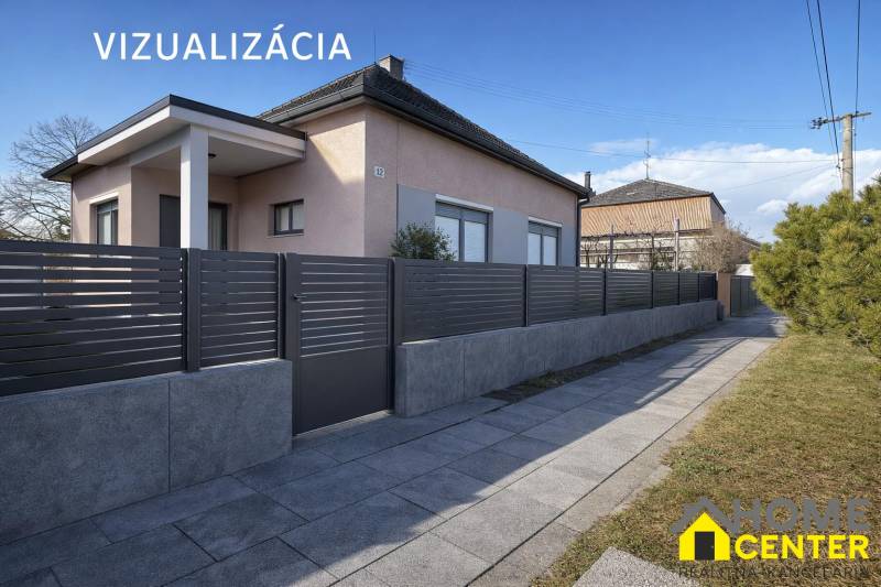 Családi ház Iž-ben modern kerítéssel és rendezett járdával.