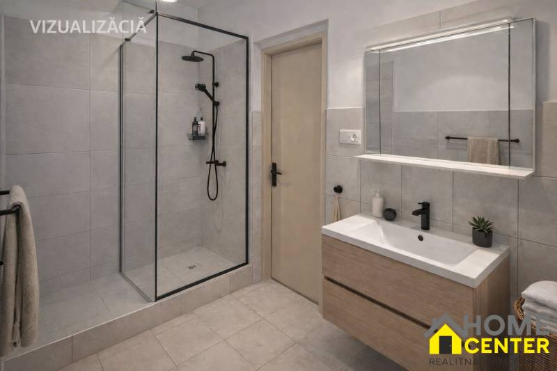 Fürdőszoba egy családi házban modern zuhanyzóval és tárolóhellyel rendelkező mosdóval.