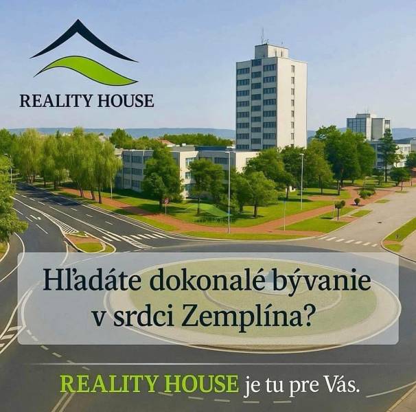 Körforgalom épületekkel és parkosított zöldterülettel Hnojné városában, kategória: Lakóövezeti telkek.