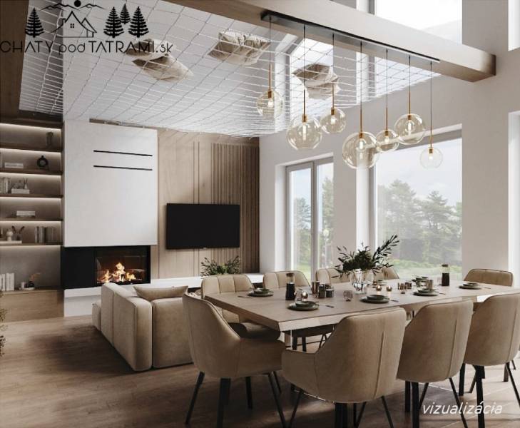 Egy étkezőasztallal, kandallóval és fa dekorációjú padlóval rendelkező ház belső tere, csillárokkal megvilágítva.