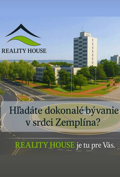 Épület körforgalommal és zöldterülettel a Michalovce városában.