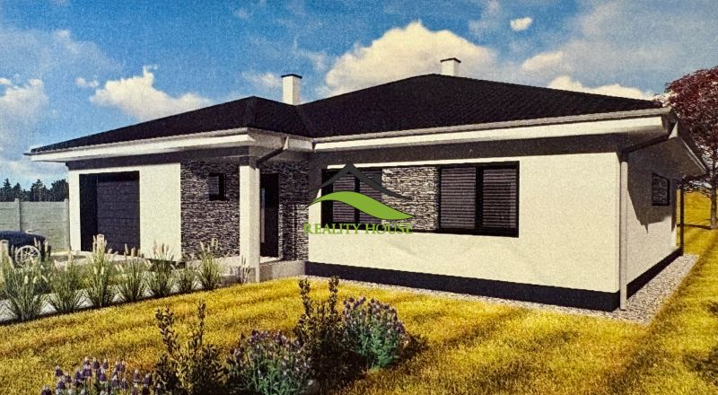 Családi ház Dúbravkán kőburkolattal, fehér homlokzattal és a ház előtti gyepfelülettel.