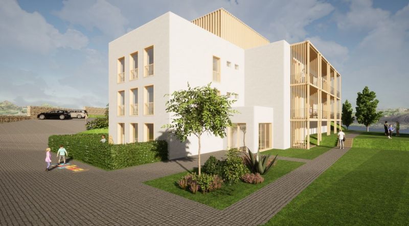 Épület Új Lesnán zölddel körülvéve, a szállodák és panziók része.