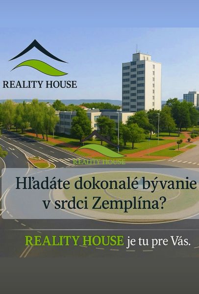 Épület körforgalommal és zöldterülettel a Michalovce városában.